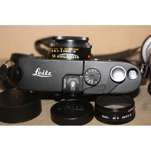 883 - A LEICA M4P FILM CAMERA in black Serial No 1547392 fitted with an Elmar M 50mm f2.8 lens, an Elmar 9... 