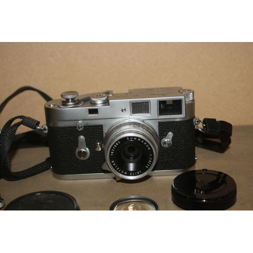 884 - A LEICA M2 FILM CAMERA in chrome Serial no 1051963 fitted with a Summaron 35mm f2.8 lens, a Summicro... 