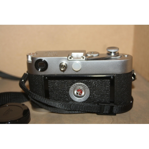 884 - A LEICA M2 FILM CAMERA in chrome Serial no 1051963 fitted with a Summaron 35mm f2.8 lens, a Summicro... 