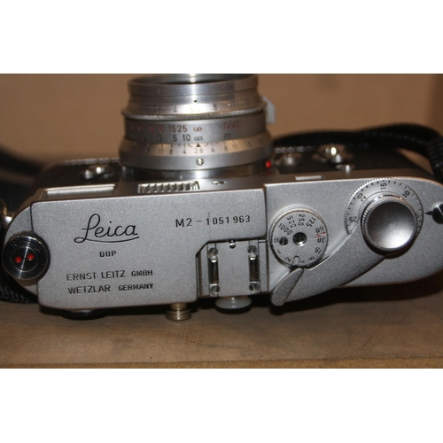 884 - A LEICA M2 FILM CAMERA in chrome Serial no 1051963 fitted with a Summaron 35mm f2.8 lens, a Summicro... 