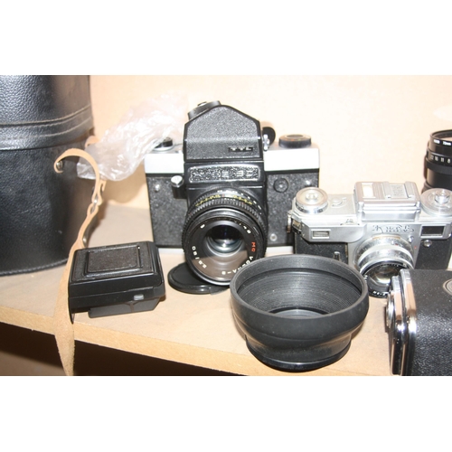 893 - A KIEV 88 MEDIUM FORMAT CAMERA fitted with a 80mm f2.8 lens, a 55mm f4.5 lens, a prismatic viewer, f... 