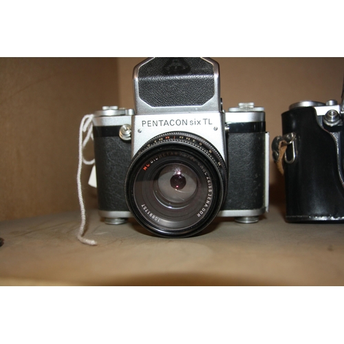 896 - TWO PENTACON SIX TL FILM CAMERAS both with Biometar 80mm f2.8 lens and one with leather case and two... 