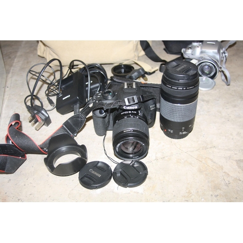 911 - A TRAY CONTAINING A CANON EOS1200D DIGITAL SLR with a 18-55 EFS and 75-300 f4 EF lenses, two charger... 