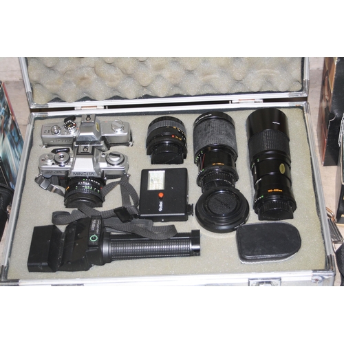 912 - A TRAY CONTAINING CAMERA EQUIPMENT including an Aluminium case, a Minolta XG-M, a Minolta SRT100X fi... 