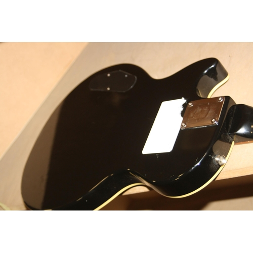 927 - AN EPOCH LES PAUL TYPE GUITAR with black finish, two humbucking pickups, one volume one tone control... 