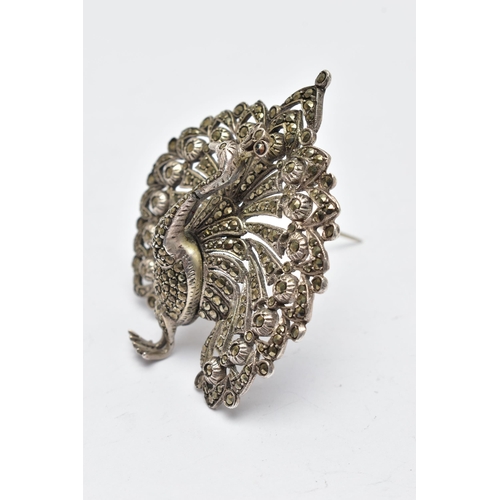 928A - A WHITE METAL AND MARCASITE BROOCH, in the form of a peacock, open work detail set with circular cut... 