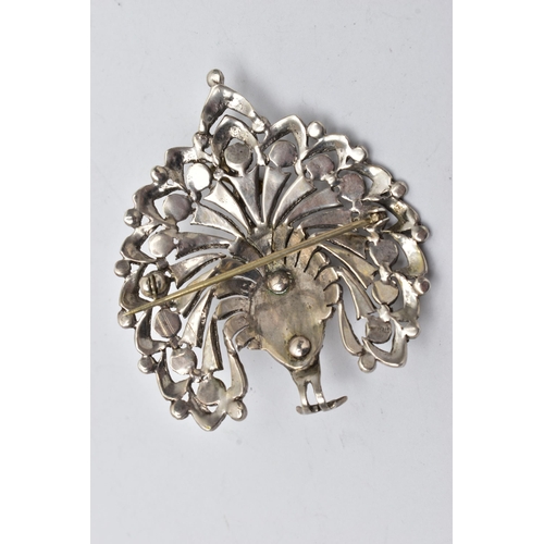 928A - A WHITE METAL AND MARCASITE BROOCH, in the form of a peacock, open work detail set with circular cut... 