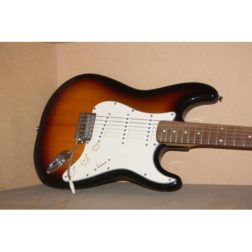 929 - A 2005 SQUIER STARTOCASTER mad in Indonesia, with tobacco sunburst finish, off white scratch plate, ... 