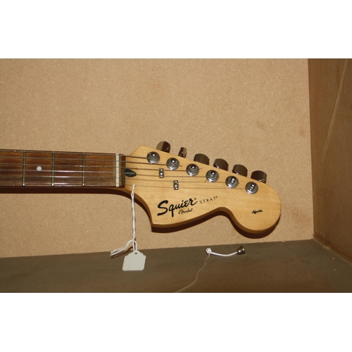 929 - A 2005 SQUIER STARTOCASTER mad in Indonesia, with tobacco sunburst finish, off white scratch plate, ... 