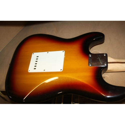 929 - A 2005 SQUIER STARTOCASTER mad in Indonesia, with tobacco sunburst finish, off white scratch plate, ... 