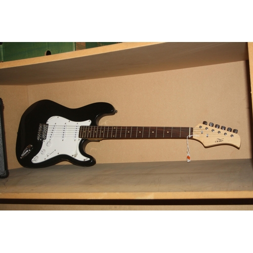 930 - A CB SKY STRAT TYPE GUITAR with black finish and a Ion iGA03 practice amp (untested)