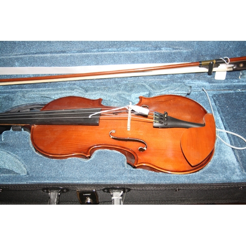 939 - TWO MODERN VIOLINS IN CASES one is a Chinese MV007 the other is unbranded with two bows