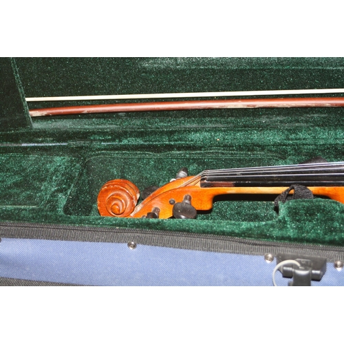 939 - TWO MODERN VIOLINS IN CASES one is a Chinese MV007 the other is unbranded with two bows