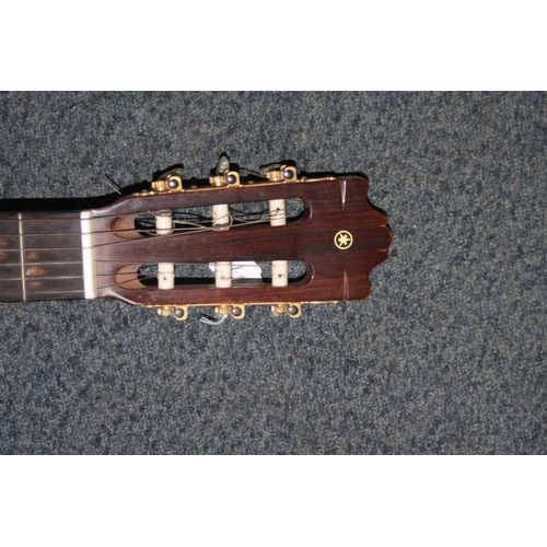 942 - A YAMAHA G-240 CLASSICAL GUITAR with laminated cedar top, laminated rosewood back and sides, rosewoo... 