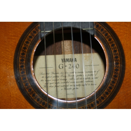 942 - A YAMAHA G-240 CLASSICAL GUITAR with laminated cedar top, laminated rosewood back and sides, rosewoo... 