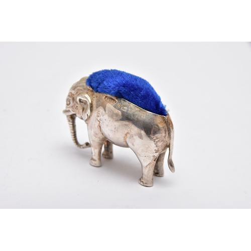 946A - AN EDWARDIAN SILVER PIN CUSHION IN THE FORM OF A STANDING ELEPHANT, makers Adie & Lovekin Ltd, Birmi... 