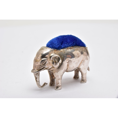 946A - AN EDWARDIAN SILVER PIN CUSHION IN THE FORM OF A STANDING ELEPHANT, makers Adie & Lovekin Ltd, Birmi... 