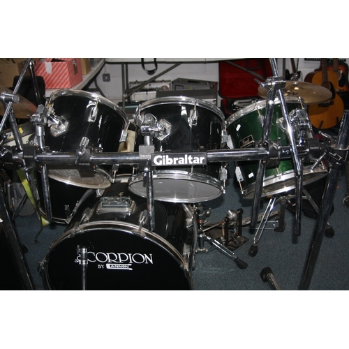 948 - A GIBRALTAR DRUM RACK with three supports, two cross bars, 14 clamps, a four piece Cannon drum kit i... 