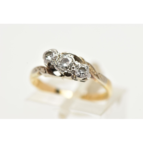 13 - A THREE STONE DIAMOND RING, three round brilliant cut diamonds. set in a white metal twisted mount, ... 