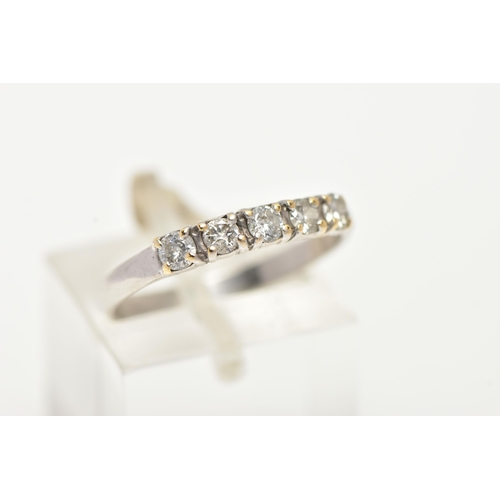 14 - A FIVE STONE DIAMOND RING, five round brilliant cut diamonds prong set in a white metal band, approx... 