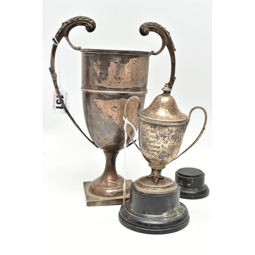 151 - TWO 20TH CENTURY SILVER TWIN HANDLED TROPHY CUPS, the larger example on a square base, marks partial... 