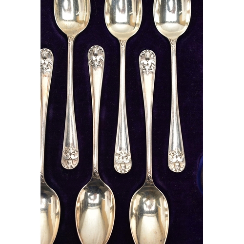 153 - A CASED SET OF TWELVE GEORGE V SILVER TEASPOONS AND MATCHING SUGAR TONGS, foliate design to the hand... 