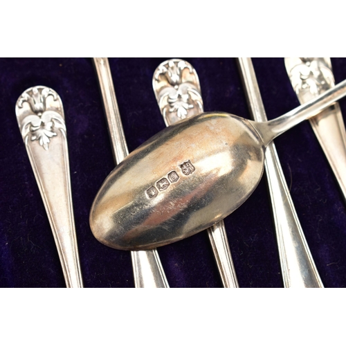 153 - A CASED SET OF TWELVE GEORGE V SILVER TEASPOONS AND MATCHING SUGAR TONGS, foliate design to the hand... 