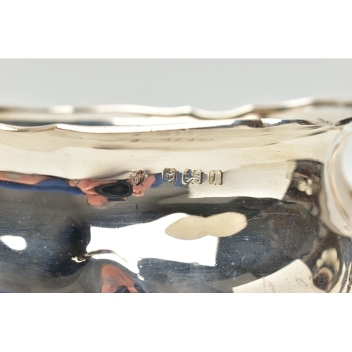 154 - AN EDWARDIAN SILVER TWIN HANDLED SUGAR BOWL AND MILK JUG OF BOMBÉ FORM, on four cabriole legs, maker... 