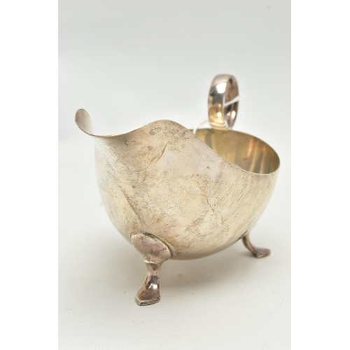 159 - A GEORGE VI SILVER SAUCE BOAT, of plain form, on three cabriole legs, ring handle, makers James Dixo... 