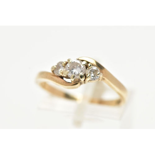 16 - A 9CT GOLD THREE STONE DIAMOND RING, three round brilliant cut diamonds, approximate total diamond w... 