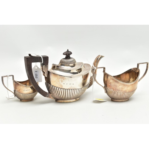 164 - AN EDWARDIAN SILVER THREE PIECE BACHELOR'S TEA SET OF OVAL FORM, reeded decoration to the lower half... 