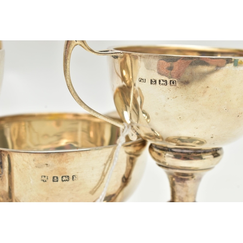 165 - THREE 20TH CENTURY SILVER TWIN HANDLED TROPHY CUPS, comprising two with enamelled crests, one inscri... 