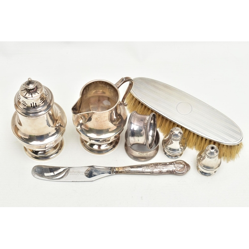 166 - A SMALL PARCEL OF 20TH CENTURY SILVER, comprising a George V sugar caster and matching cream jug of ... 