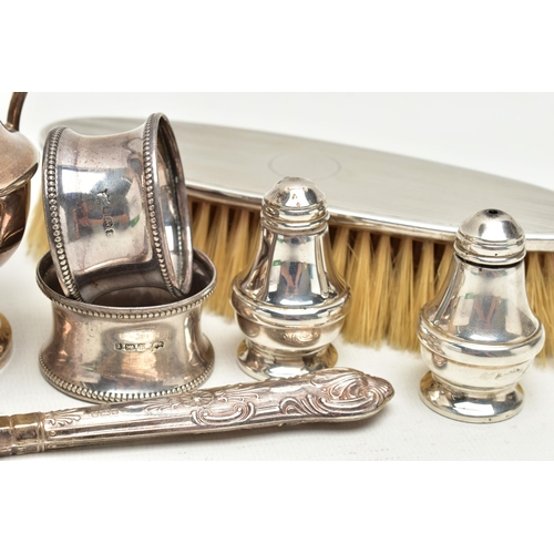 166 - A SMALL PARCEL OF 20TH CENTURY SILVER, comprising a George V sugar caster and matching cream jug of ... 