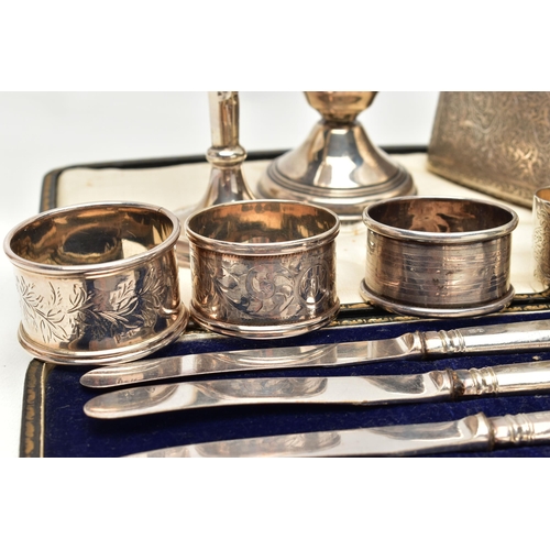 168 - A SELECTION OF SILVER ITEMS, to include a silver tapered posy vase, with wavy rim on a round weighte... 