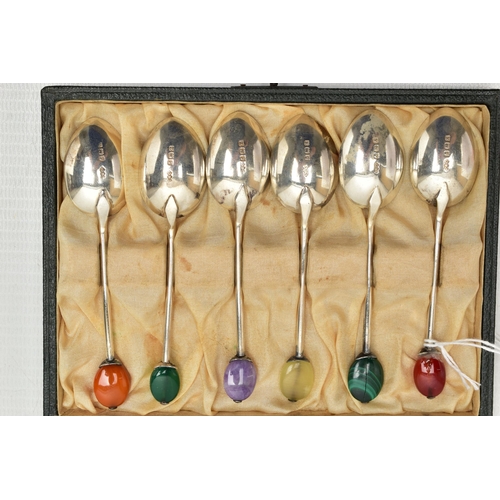 169 - A CASED SET OF SIX SILVER COFFEE SPOONS, each polished spoon is set to the terminal with a semi-prec... 