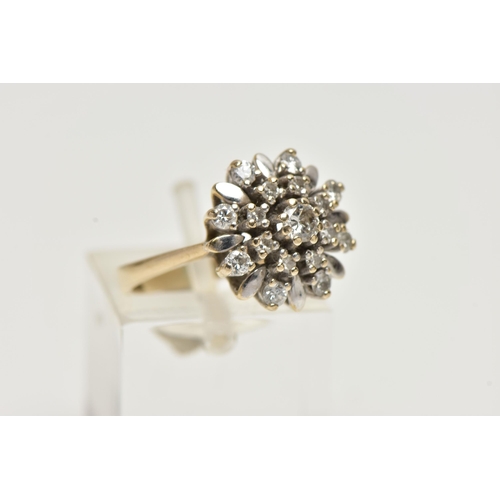 22 - A YELLOW METAL DIAMOND CLUSTER RING, flower shape cluster, set with round brilliant cut and single c... 