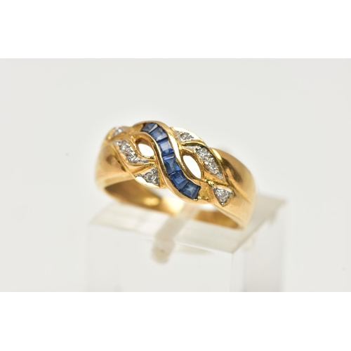 23 - A YELLOW METAL SAPPHIRE AND DIAMOND RING, designed with a row of square cut blue sapphires, channel ... 