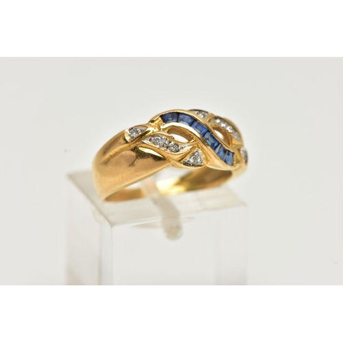 23 - A YELLOW METAL SAPPHIRE AND DIAMOND RING, designed with a row of square cut blue sapphires, channel ... 