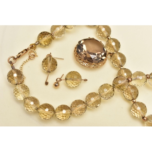 26 - A SMOKY QUARTZ BEADED NECKLACE AND MATCHING EARRINGS, the necklace made up of thirty-eight faceted r... 