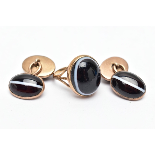 28 - A 9CT GOLD BANDED AGATE RING AND PAIR OF CUFFLINKS, the ring set with an oval cut banded bulls eye a... 