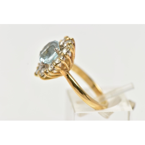 4 - A YELLOW METAL AQUAMARINE AND DIAMOND CLUSTER RING, centring on a four claw set, cushion cut aquamar... 