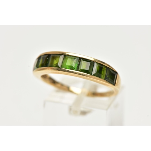 40 - A 9CT GOLD GEM SET RING, designed with a row of channel set, graduating square cut green tourmalines... 