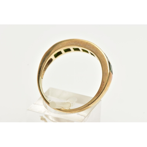 40 - A 9CT GOLD GEM SET RING, designed with a row of channel set, graduating square cut green tourmalines... 