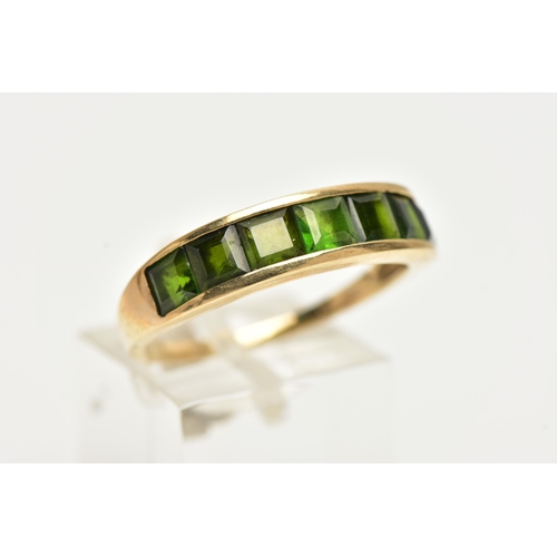 40 - A 9CT GOLD GEM SET RING, designed with a row of channel set, graduating square cut green tourmalines... 