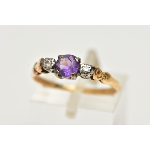 48 - A YELLOW METAL AMETHYST AND DIAMOND RING, centring on a claw set, circular cut amethyst, flanked wit... 