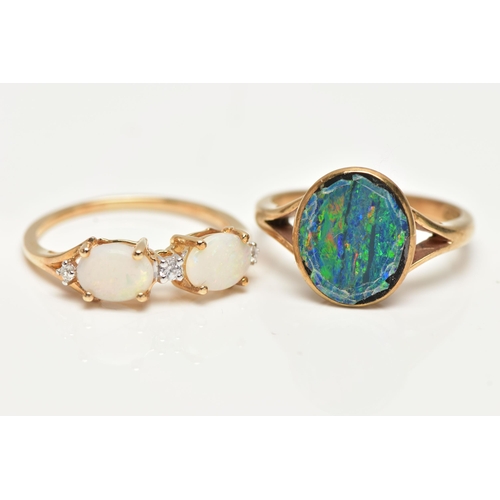 49 - TWO OPAL RINGS, the first designed with two claw set, oval cut opal cabochons, interspaced with roun... 