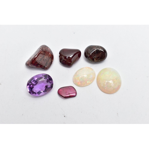 56 - A SMALL BAG OF ASSORTED LOOSE GEMSTONES, to include two white opal cabochons, both showing flashes a... 