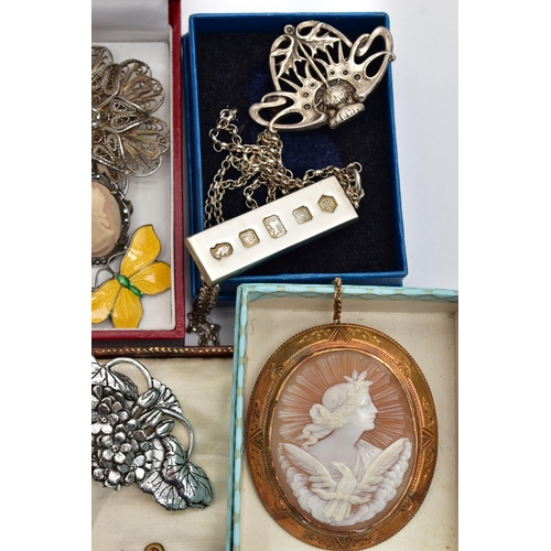 58 - A BAG OF ASSORTED JEWELLERY, to include a gold plated, metal core hinged bangle, a carved shell came... 