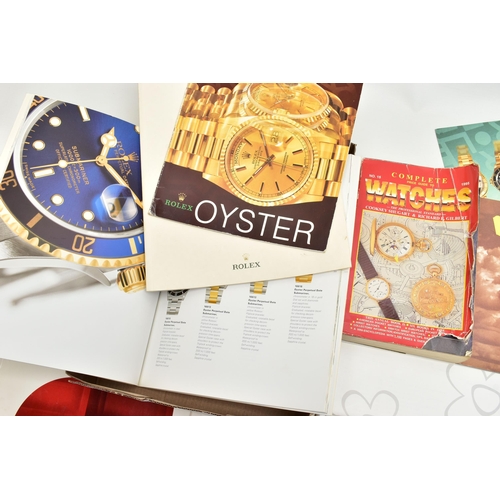 64 - A SELECTION OF WATCH CATALOGUES AND BOOKLETS, to include an 'Omega collection' booklet, an 'Omega ' ... 